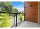 Balcony with a view of mature trees and a neighborhood street at 367 Parkway Ne Dr # 4, Atlanta, GA 30312