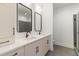 Elegant bathroom featuring a double sink vanity, framed mirrors, and a walk-in shower at 367 Parkway Ne Dr # 4, Atlanta, GA 30312