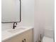 Modern half-bath featuring a sleek vanity, black accents, and a contemporary mirror at 367 Parkway Ne Dr # 4, Atlanta, GA 30312