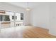 Dining area featuring hardwood floors, minimalist trim, a modern pendant light, and abundant natural light at 367 Parkway Ne Dr # 4, Atlanta, GA 30312