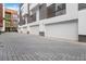 This building features multiple garages with white doors and brick accents at 367 Parkway Ne Dr # 4, Atlanta, GA 30312