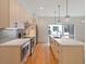 Bright kitchen featuring stainless steel appliances, light wood cabinets, and a large island with sink at 367 Parkway Ne Dr # 4, Atlanta, GA 30312