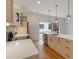 Open concept kitchen with modern appliances, white countertops, and stylish pendant lights above the island at 367 Parkway Ne Dr # 4, Atlanta, GA 30312