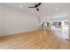 Spacious living room with hardwood floors, recessed lighting, and a view of the adjacent kitchen and outdoor area at 367 Parkway Ne Dr # 4, Atlanta, GA 30312