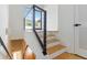 A modern staircase with metal railings and hardwood steps at 367 Parkway Ne Dr # 4, Atlanta, GA 30312