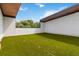Outdoor terrace featuring green turf, privacy fence and wood ceilings at 367 Parkway Ne Dr # 4, Atlanta, GA 30312