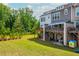 Well-manicured backyard with a grassy area and patio space for entertaining at 996 Layton Dr, Buford, GA 30518