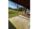 Patio underneath a deck with a view of a sloped green lawn at 996 Layton Dr, Buford, GA 30518