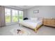 Bright bedroom with large windows, minimalist decor, and a comfortable bed with soft bedding at 996 Layton Dr, Buford, GA 30518