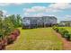 Well-maintained backyard with lush greenery bordering the lawn at 996 Layton Drive Dr, Buford, GA 30518