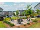 Community green with seating and a fire pit at 996 Layton Drive Dr, Buford, GA 30518