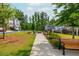 Community green space with benches, fire pit, and surrounding trees at 996 Layton Drive Dr, Buford, GA 30518