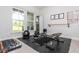 Bright home gym equipped with a treadmill, weight bench, and ballet bar, promoting a healthy lifestyle in your home at 996 Layton Drive Dr, Buford, GA 30518