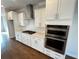 Bright kitchen features white cabinets, stainless steel appliances, and a gas cooktop at 996 Layton Drive Dr, Buford, GA 30518