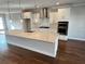Modern kitchen with stainless steel appliances, sleek countertops, and a large island at 996 Layton Drive Dr, Buford, GA 30518