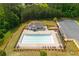 Aerial view of community swimming pool with lounge chairs and shade structure at 996 Layton Drive Dr, Buford, GA 30518