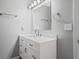 Bathroom showcasing a single vanity with sleek countertops and contemporary fixtures at 1047 Woodsong Pass Ct, Lawrenceville, GA 30043