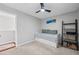 Bedroom featuring a daybed, modern decor, and ample natural light at 1047 Woodsong Pass Ct, Lawrenceville, GA 30043