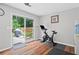 Workout area featuring a stationary bike and a sliding glass door to the back yard at 1047 Woodsong Pass Ct, Lawrenceville, GA 30043