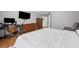 Spacious main bedroom with a home office, TV, and comfortable seating area at 1047 Woodsong Pass Ct, Lawrenceville, GA 30043