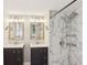 Bathroom with double vanity and rainfall shower head with white marble tiling at 3308 Quail Run Sw Sw Run, Marietta, GA 30008