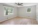 Spacious bedroom with hardwood floors, neutral walls, and double-hung windows at 3308 Quail Run Sw Sw Run, Marietta, GA 30008