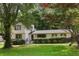 Charming home with a lush green lawn and mature trees providing shade and character at 3308 Quail Run Sw Sw Run, Marietta, GA 30008