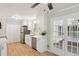 Eat-in kitchen with stainless appliances, white cabinets, quartz counters, and french doors to deck at 3308 Quail Run Sw Sw Run, Marietta, GA 30008
