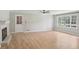 Bright living room featuring wood floors, a fireplace, and large windows for ample natural light at 3308 Quail Run Sw Sw Run, Marietta, GA 30008