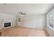 Spacious living room featuring wood flooring, a cozy fireplace, and a large window for natural light at 3308 Quail Run Sw Sw Run, Marietta, GA 30008