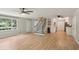 Open-concept living area with staircase, great natural light, ceiling fans, and kitchen views at 3308 Quail Run Sw Sw Run, Marietta, GA 30008