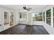 Enclosed porch area with curtains, wood floors, and a view of the backyard at 3308 Quail Run Sw Sw Run, Marietta, GA 30008