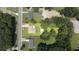 Aerial view of a home with a red border outlining the property and lot size at 4065 Old Austell Rd, Powder Springs, GA 30127