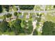 Aerial view of the property in a neighborhood, surrounded by lush greenery and trees at 4065 Old Austell Rd, Powder Springs, GA 30127