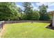 Spacious, fenced backyard with a fire pit at 4065 Old Austell Rd, Powder Springs, GA 30127