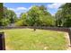Large backyard with a fire pit and a privacy fence at 4065 Old Austell Rd, Powder Springs, GA 30127