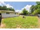 A serene, green backyard featuring a charming fire pit at 4065 Old Austell Rd, Powder Springs, GA 30127