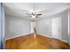 Spacious bedroom with hardwood floors, ceiling fan, and neutral walls at 4065 Old Austell Rd, Powder Springs, GA 30127