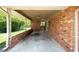 Open carport area with brick walls and a view of the backyard at 4065 Old Austell Rd, Powder Springs, GA 30127