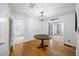 Open dining area featuring hardwood floors and modern lighting fixtures, connecting to other living spaces at 4065 Old Austell Rd, Powder Springs, GA 30127