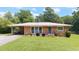 Charming brick home with a well-maintained lawn and inviting curb appeal at 4065 Old Austell Rd, Powder Springs, GA 30127