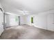 Large living room with neutral carpet, ample natural light, and an open floor plan at 4065 Old Austell Rd, Powder Springs, GA 30127