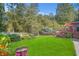 Expansive backyard featuring a large grassy area and deck perfect for outdoor entertaining at 7523 Kimberly Lynn Ct, Lithonia, GA 30058