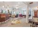 Spacious carpeted basement featuring multiple seating areas and pool table at 7523 Kimberly Lynn Ct, Lithonia, GA 30058