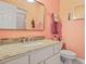 Bathroom featuring granite vanity, modern faucet, and large mirror at 7523 Kimberly Lynn Ct, Lithonia, GA 30058