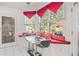 Bright breakfast nook with built-in seating, large windows, and an adjacent patio view at 7523 Kimberly Lynn Ct, Lithonia, GA 30058