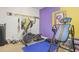 Carpeted exercise room with equipment, white and purple walls at 7523 Kimberly Lynn Ct, Lithonia, GA 30058