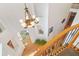 An interior view of the foyer with wooden staircase, chandelier, and decor niches at 7523 Kimberly Lynn Ct, Lithonia, GA 30058