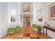 Bright foyer with gleaming hardwood floors and a view of the second story at 7523 Kimberly Lynn Ct, Lithonia, GA 30058