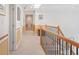 Hallway showing upper floor with carpet, baseboard trim, railing and staircase at 7523 Kimberly Lynn Ct, Lithonia, GA 30058